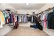 Spacious walk-in closet with ample storage and shelving for organizing clothes and accessories at 428 Wheat Field Dr, Mount Holly, NC 28120