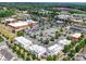 Aerial view of a commercial area with multiple shops, restaurants, ample parking, and green landscaping at 4434 Patriots Hill Rd, Mint Hill, NC 28227