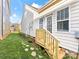 Landscaped backyard with stone path and staircase at 4434 Patriots Hill Rd, Mint Hill, NC 28227