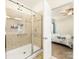 Tiled bathroom and glass shower with access to the carpeted bedroom at 4434 Patriots Hill Rd, Mint Hill, NC 28227