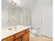 Bright bathroom featuring a single vanity and a toilet at 4434 Patriots Hill Rd, Mint Hill, NC 28227