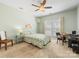 Bedroom featuring carpet, a ceiling fan, a bed and desk area, plus natural lighting at 4434 Patriots Hill Rd, Mint Hill, NC 28227