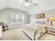 Bedroom features a white bed frame and furniture, large windows, and neutral walls at 4434 Patriots Hill Rd, Mint Hill, NC 28227