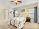 Comfortable bedroom with neutral walls, carpeted floor, and decorative blue accents at 4434 Patriots Hill Rd, Mint Hill, NC 28227
