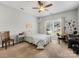 Bright bedroom with neutral walls, ceiling fan, and carpeted floor at 4434 Patriots Hill Rd, Mint Hill, NC 28227