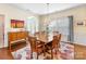 Dining room with hardwood floors, dining table, and a chandelier at 4434 Patriots Hill Rd, Mint Hill, NC 28227