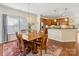 Dining room with hardwood floors, dining table and direct views of the kitchen at 4434 Patriots Hill Rd, Mint Hill, NC 28227