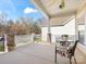 Open front porch with stone supports and outdoor seating at 4434 Patriots Hill Rd, Mint Hill, NC 28227
