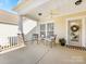 Inviting front porch with seating and decorative touches at 4434 Patriots Hill Rd, Mint Hill, NC 28227