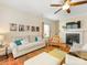 Cozy living room with fireplace, television and large area rug at 4434 Patriots Hill Rd, Mint Hill, NC 28227