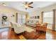 Bright living room with hardwood floors and matching sofas at 4434 Patriots Hill Rd, Mint Hill, NC 28227