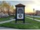 Brighton Park community sign at sunset with flowering trees at 4434 Patriots Hill Rd, Mint Hill, NC 28227
