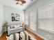 Sitting room with hardwood floors, pull out couch, natural light, and private door at 4434 Patriots Hill Rd, Mint Hill, NC 28227