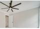 A cozy bedroom with neutral colored walls, white trim, and a ceiling fan for comfort at 4731 Whispering Oaks Dr, Charlotte, NC 28213