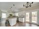 Inviting kitchen with an island and stainless steel appliances, offering a seamless flow to the outdoor area at 4731 Whispering Oaks Dr, Charlotte, NC 28213