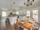 Eat-in kitchen with a view, featuring modern appliances and a dining area that seats six comfortably at 4731 Whispering Oaks Dr, Charlotte, NC 28213