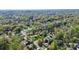 Aerial view of a property nestled in a lush, green, tree-filled neighborhood at 501 Eastwood Dr, Gastonia, NC 28054