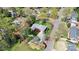 Aerial view of a home with mature trees and lush landscaping surrounded by a red boundary at 501 Eastwood Dr, Gastonia, NC 28054