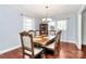 Elegant dining room with chandelier, hardwood floors, and built-in display cabinet at 501 Eastwood Dr, Gastonia, NC 28054
