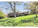 Charming two-story brick home with well-manicured lawn and mature trees offering curb appeal at 501 Eastwood Dr, Gastonia, NC 28054