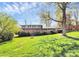Landscaped two-story home with a brick facade, a well-manicured lawn, and mature trees at 501 Eastwood Dr, Gastonia, NC 28054