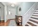 Inviting foyer with hardwood floors, decorative mirror, and staircase leading to upper level at 501 Eastwood Dr, Gastonia, NC 28054