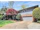 Beautiful home with a two-car garage, manicured lawn, and vibrant landscaping at 501 Eastwood Dr, Gastonia, NC 28054