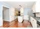 Spacious kitchen boasts ample cabinet space, granite countertops, stainless steel appliances, and hardwood floors at 501 Eastwood Dr, Gastonia, NC 28054
