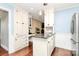 Charming kitchen with granite countertops, a breakfast bar, hardwood floors, and ample cabinet space at 501 Eastwood Dr, Gastonia, NC 28054