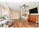 Inviting living room with hardwood floors, neutral walls, and a modern ceiling fan at 501 Eastwood Dr, Gastonia, NC 28054