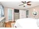 Spacious main bedroom with a ceiling fan, wood floors, and ample storage at 501 Eastwood Dr, Gastonia, NC 28054
