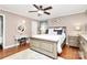 Beautiful main bedroom with a ceiling fan, wood floors, and a charming vanity at 501 Eastwood Dr, Gastonia, NC 28054