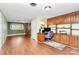 Well-lit office area with built-in wooden cabinetry, a desk, and a comfortable chair at 501 Eastwood Dr, Gastonia, NC 28054