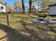 Expansive backyard showcasing multiple outdoor living spaces, including a fire pit area and rear deck at 609 Mccarten St, Monroe, NC 28112