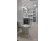 Bathroom with gray cabinets, white countertops, and large wall shelving at 609 Mccarten St, Monroe, NC 28112