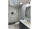Remodeled bathroom featuring a tiled shower, modern vanity, and contemporary fixtures at 609 Mccarten St, Monroe, NC 28112