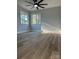 Bedroom with hardwood floors, new ceiling fan, and large windows with great lighting at 609 Mccarten St, Monroe, NC 28112