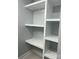 Custom closet with built-in white shelves at 609 Mccarten St, Monroe, NC 28112