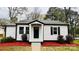 Charming, updated cottage-style home with a freshly painted exterior and manicured landscaping at 609 Mccarten St, Monroe, NC 28112