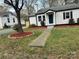 Well-maintained front yard with fresh landscaping, a walkway, and a view of the house at 609 Mccarten St, Monroe, NC 28112