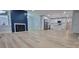 Spacious living area with fireplace and a view of the kitchen with stainless steel appliances at 609 Mccarten St, Monroe, NC 28112