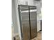 Stainless steel refrigerator complementing white cabinets in a bright and modern kitchen setting at 609 Mccarten St, Monroe, NC 28112
