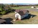 A side aerial view shows a well-maintained single story home and surrounding landscape at 6441 Highway 73 W Hwy, Mount Gilead, NC 27306
