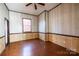 Simple bedroom featuring wood-paneled walls and wood flooring providing rustic comfort at 6441 Highway 73 W Hwy, Mount Gilead, NC 27306