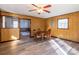 Dining room featuring hardwood floors, a ceiling fan, and natural light from the windows at 6441 Highway 73 W Hwy, Mount Gilead, NC 27306
