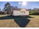 A cozy single story home features a covered porch, a well-manicured lawn and trees at 6441 Highway 73 W Hwy, Mount Gilead, NC 27306