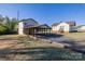 Exterior view displaying house with detached garage, driveway and lawn at 6441 Highway 73 W Hwy, Mount Gilead, NC 27306