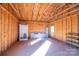 New garage with a spacious open interior, shower stall and shelving at 6441 Highway 73 W Hwy, Mount Gilead, NC 27306