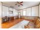 Living room area with hardwood floors, large rug, and windows that bring in natural light at 6441 Highway 73 W Hwy, Mount Gilead, NC 27306