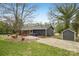 Home exterior with a screened-in porch and a matching shed in the yard at 6501 Thamesmead Ln, Mint Hill, NC 28227